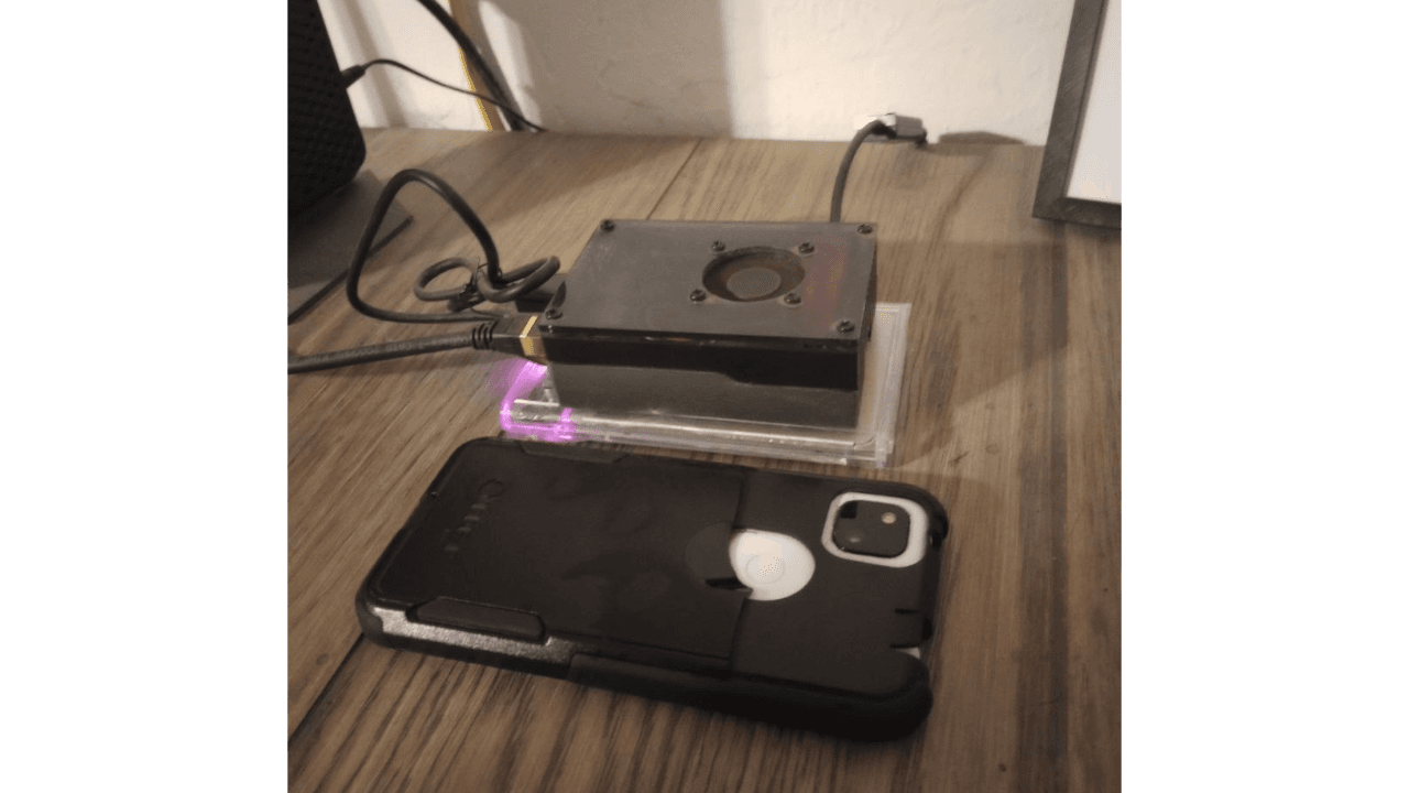 Image of a Raspberry Pi 4 Bitcoin node, with my phone next to it for scale